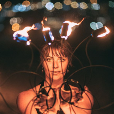 beautiful fire dancer performance profile picture with fire fans